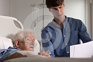 Elder patient watching his results