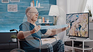 Elder person with disability stretching resistance band to exercise