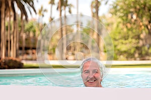 Elder woman enjoying pool photo