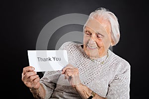 Elder Woman Showing Thank You Card