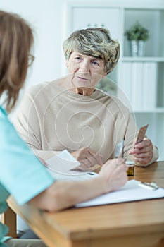 Elder woman with social worker