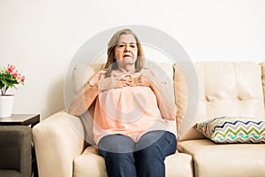 Elder woman suffering heartache