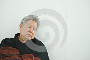 elder woman taking a nap. asian elderly senior napping sleeping photo