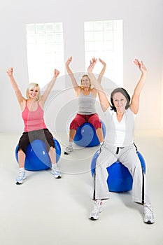 Elder women exercising on fitness balls