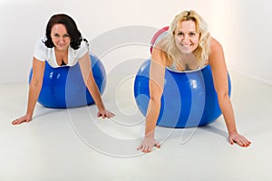 Elder women exercising on fitness balls