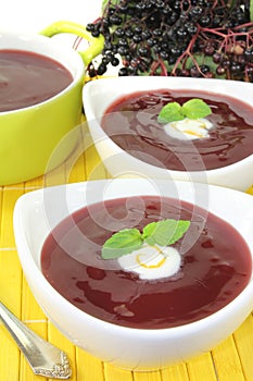 Elderberries soup with whipped cream