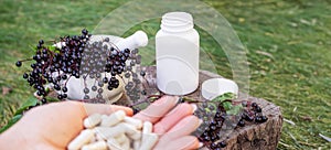 Elderberry and Capsules for Immunity in Hand