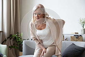 Elderly 60s woman suffer from back ache