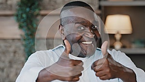 Elderly African American excited senior man happy winner grandpa showing two thumbs up positive hand gesture smiling