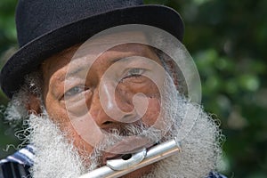 Elderly African American Man Playing Flute