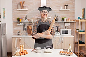 Elderly age man wearing chef bonete photo