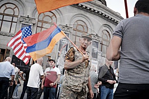 An elderly Armenian man in a camouflage suit