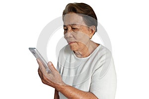 Elderly asian woman are using mobile phone with a smile isolated on white
