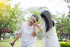 Elderly asian women having a headache suffering from migraine disease,Female take care and support