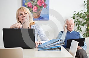 Elderly businesspeople working at home