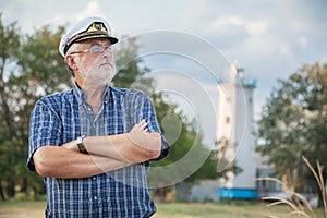 Elderly captain on the sea shore