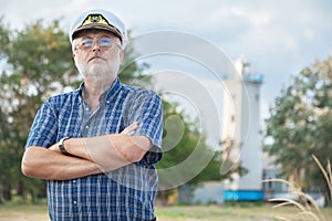 Elderly captain on the sea shore