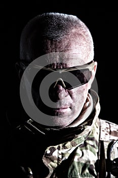 Elderly commando fighter studio portrait on black