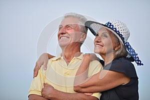 Elderly couple on the background of sky
