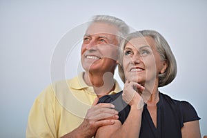 Elderly couple on the background of sky