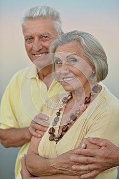 Elderly couple on the background of sky