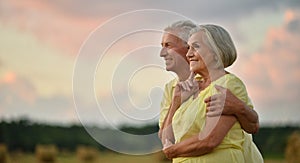 Elderly couple on the background of sky