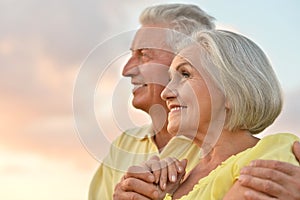 Elderly couple on the background of sky