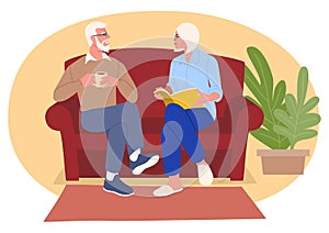 Elderly couple comfortably engaged in a sofa conversation photo