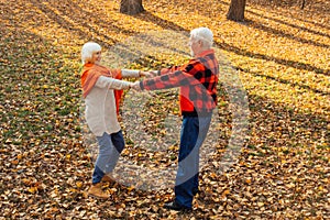 An elderly couple is dancing. Smiling old woman. Movement is life. I feel young again