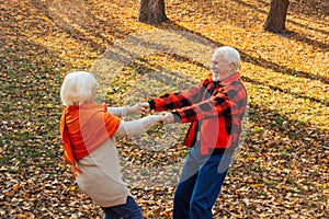 An elderly couple is dancing. Smiling old woman. Movement is life. I feel young again