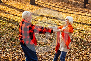 An elderly couple is dancing. Smiling old woman. Movement is life. I feel young again