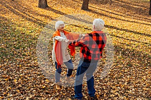 An elderly couple is dancing. Smiling old woman. Movement is life. I feel young again