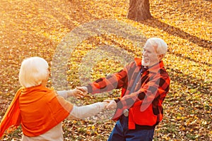 An elderly couple is dancing. Smiling old woman. Movement is life. I feel young again