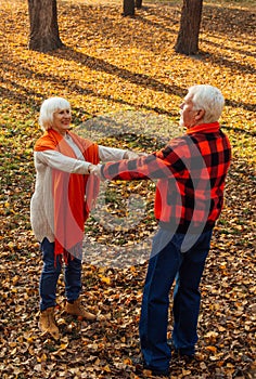 An elderly couple is dancing. Smiling old woman. Movement is life. I feel young again