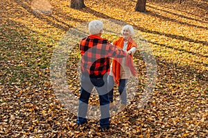 An elderly couple is dancing. Smiling old woman. Movement is life. I feel young again