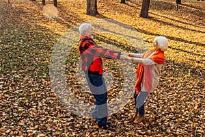 An elderly couple is dancing. Smiling old woman. Movement is life. I feel young again