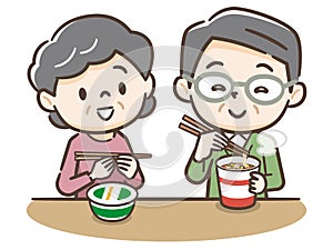 Elderly couple eating cup ramen