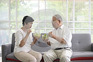 Elderly couple are eating healthy food , grandparents health care concept