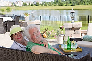 Elderly couple enjoy a relaxing day on the patio