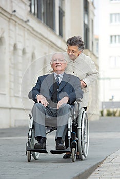 Elderly couple going for stroll