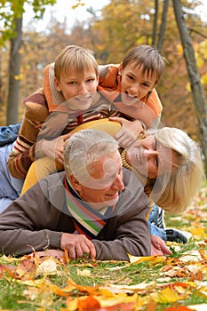 Elderly couple and grandchildren lie