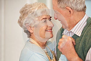 Elderly, couple and happy with dancing in home for bonding, support and holding hands with romance. Senior, man and