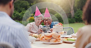 Elderly, couple and happy with video call at birthday party for celebration, laughing and memories in garden. Senior