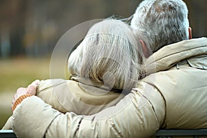 Portrait of elderly couple in autumn park
