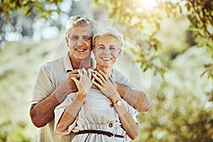 Elderly, couple with hug in park and love with marriage portrait, retirement travel together with commitment outdoor
