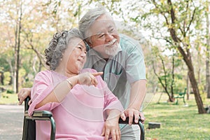 Elderly couple with lifestyle after retiree concept. Lovely asian seniors couple embracing together in the park in the