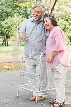 elderly couple with lifestyle after retiree concept. Lovely asian seniors couple walking exercise in the park in the morning