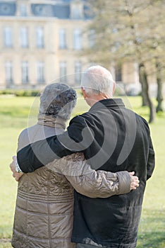 Elderly couple looking at building