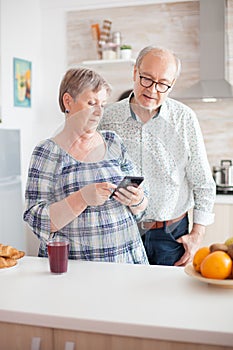 Elderly couple looking on internet