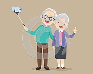 Elderly couple making selfie photo with smartphone